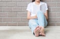 Woman sitting at the corner of house for reading a white book in free time in the afternoon , relax time of asian woman Royalty Free Stock Photo