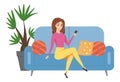 Woman is sitting on the couch. Beautiful girl with a TV remote control or a phone in her hands