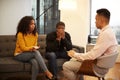 Woman Sitting On Couch Meeting With Male Relationship Counsellor In Office Royalty Free Stock Photo