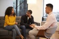 Woman Sitting On Couch Meeting With Male Relationship Counsellor In Office Royalty Free Stock Photo