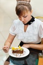 Woman sitting eating cake Royalty Free Stock Photo