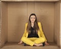 Woman sitting in an empty office