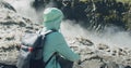 Woman sitting and enjoying the edge of powerful Detifoss waterfall in Iceland Royalty Free Stock Photo