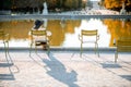 Woman sitting on the famous green chair in Paris