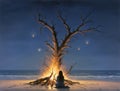 Woman sitting by the fire on a beach at night Royalty Free Stock Photo