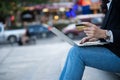 A woman sitting on the floor holding a credit card and laptop for her name online paying via internet banking. Royalty Free Stock Photo