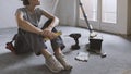 Woman sitting on the floor and planning a home renovation Royalty Free Stock Photo