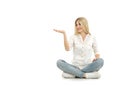 Woman sitting on the floor and pointing with her finger Royalty Free Stock Photo
