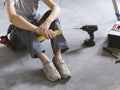 Woman sitting on the floor and planning a home renovation Royalty Free Stock Photo