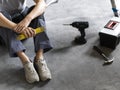 Woman sitting on the floor and planning a home renovation Royalty Free Stock Photo