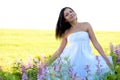 Woman sitting in the flowers Royalty Free Stock Photo