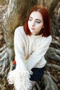 Woman sitting in forest enjoys the silence and beauty of nature. Royalty Free Stock Photo