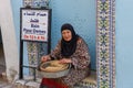 Woman sitting in front of a hammam at Sousse in Tunisia