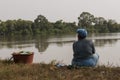 Woman sitting on the gambia river
