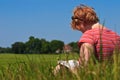 Woman sitting in the grass raeding a book Royalty Free Stock Photo