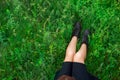 Woman sitting on green grass top view Royalty Free Stock Photo