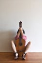 A woman sitting with a guitar