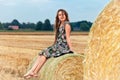 Woman sitting on hay bale Royalty Free Stock Photo