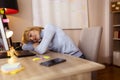 Woman tired at work, sleeping at her desk Royalty Free Stock Photo