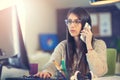 Woman sitting in home office at desk working on computer Royalty Free Stock Photo