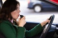 Woman Sitting Inside Car Taking Alcohol Test