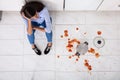 Woman Sitting On Kitchen Floor With Spilled Food Royalty Free Stock Photo