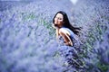 Woman sitting on a lavender field