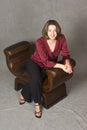 Woman sitting on leather chair