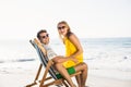 Woman sitting on mans lap at beach Royalty Free Stock Photo