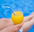 Woman holding glass with orange juice Royalty Free Stock Photo