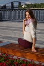 Woman sitting nearthe river bank Royalty Free Stock Photo