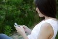 Woman sitting on the outdoor bench Royalty Free Stock Photo