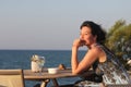 Woman sitting in outdoor cafe