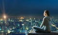 Woman is sitting over the city Royalty Free Stock Photo