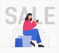 Woman sitting with packages on gift box and shopping online, with shopping bag. Big discount, gifts and purchases, sales Royalty Free Stock Photo