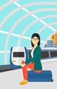 Woman sitting on railway platform.