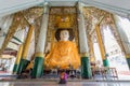 Woman sitting respectfully big Buddha Royalty Free Stock Photo