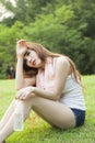 Woman sitting rest after exercise. Royalty Free Stock Photo