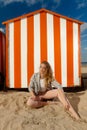 Woman beach sun sand hut, De Panne, Belgium