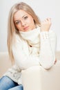 Woman sitting on sofa Royalty Free Stock Photo