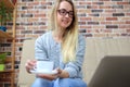 Woman sitting on sofa and remote working Royalty Free Stock Photo