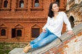 Woman sitting on stone staircase railing Royalty Free Stock Photo