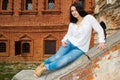 Woman sitting on stone staircase railing Royalty Free Stock Photo