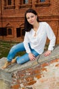 Woman sitting on stone staircase railing Royalty Free Stock Photo