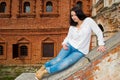 Woman sitting on stone staircase railing Royalty Free Stock Photo