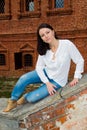 Woman sitting on stone staircase railing Royalty Free Stock Photo