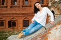 Woman sitting on stone staircase railing Royalty Free Stock Photo