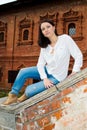 Woman sitting on stone staircase railing Royalty Free Stock Photo