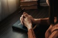 Woman sitting and studying the scriptures.The wooden cross in the hands. Christian education concepts The Holy Royalty Free Stock Photo