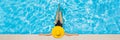 Woman sitting in a swimming pool in a large yellow sunhat BANNER, LONG FORMAT Royalty Free Stock Photo